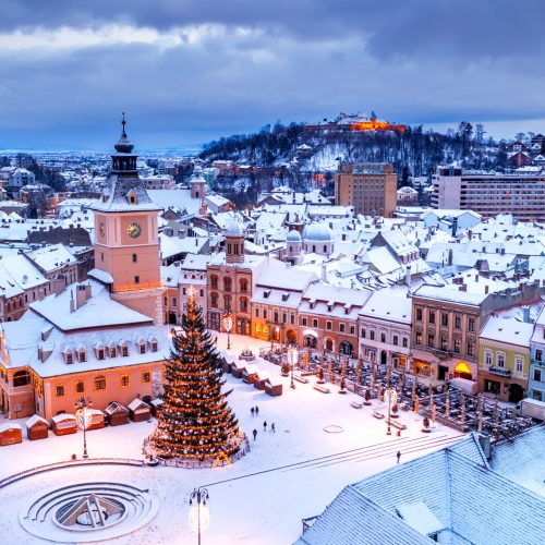 Brasov, Romania. Winter Christmas aerial view of Council Square and Christmas Tree, Transylvania landmark, Eastern Europe